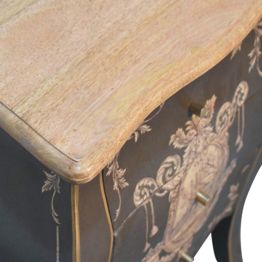 Vintage wooden desk with ornate floral design.