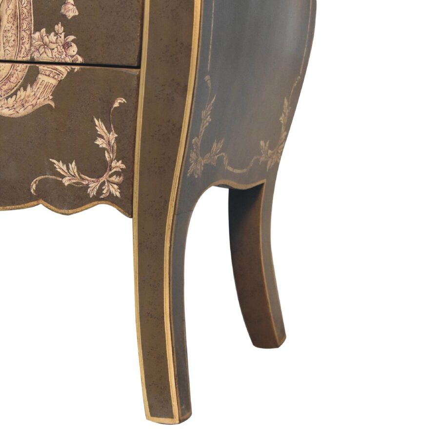 Antique-style decorated wooden table leg.