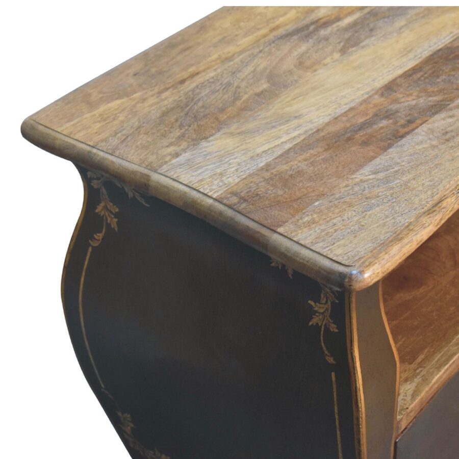 Antique wooden table with ornate gold detailing.