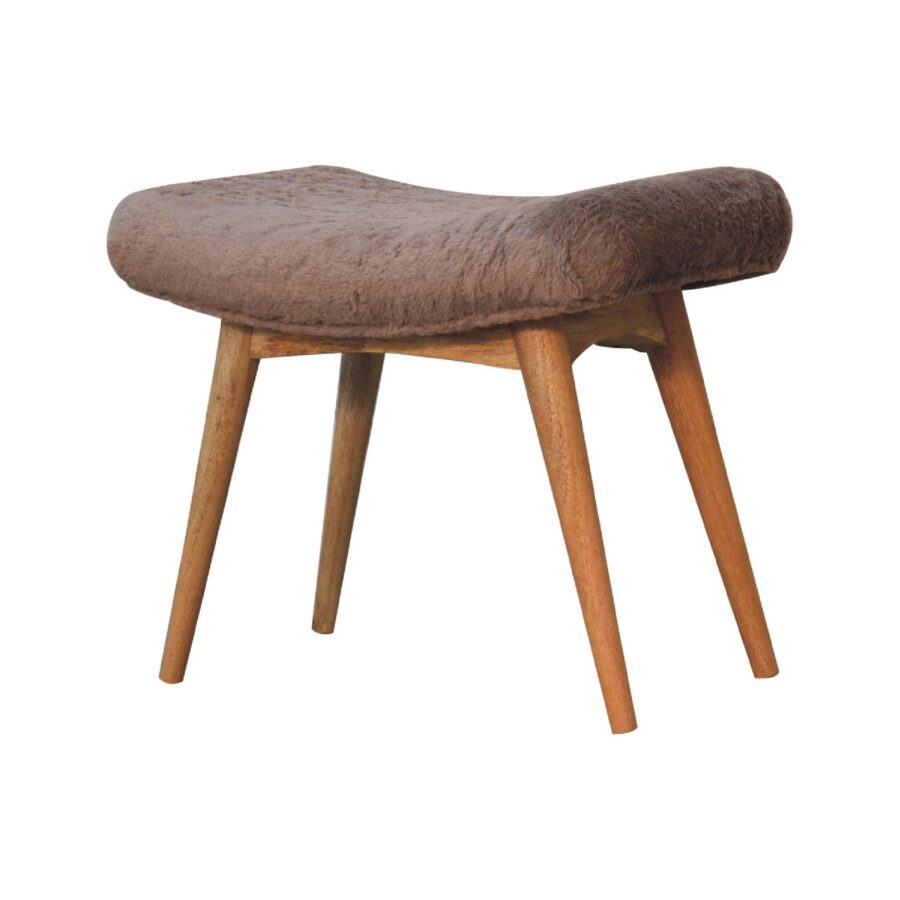 Fur-covered wooden stool on white background