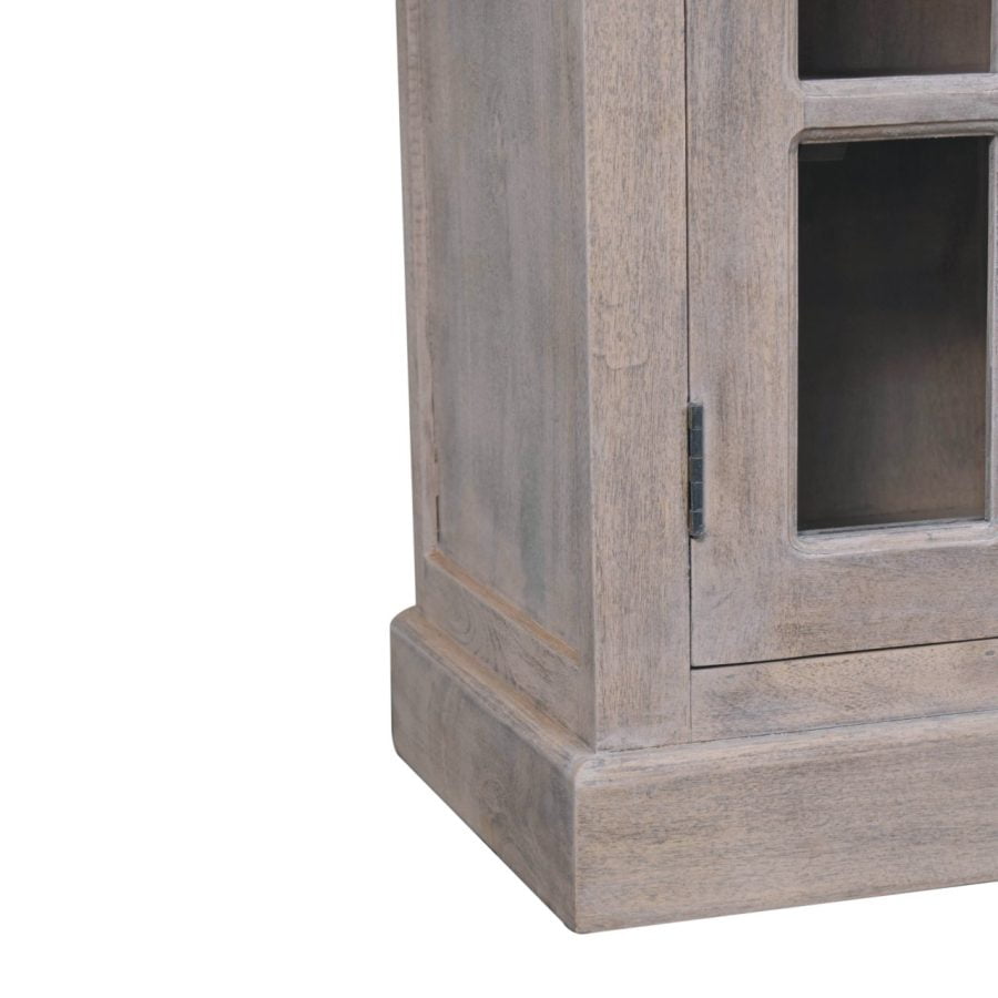 Wooden display cabinet corner on white background.